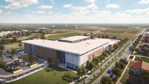 Rendering of a two-story school from aerial perspective. It has a large, flat L-shaped roof with a smaller square roof popped out in the inside of the "L." It's set on a large green field and surrounded by trees and has a shaded courtyard on one side.