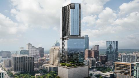 Rendering of a very tall glass building with three stacked blocky sections, each one narrower than the one below it. It's closely surrounded by mid-height and shorter buildings.