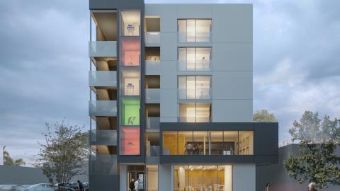 Rendering of a contemporary, two-story apartment building. Two people are entering the building, and one person is approaching from farther away.