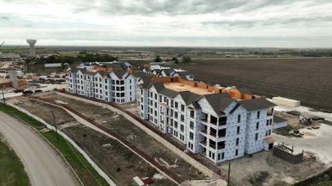 Aerial photo of a large apartment community under construction.