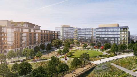 Rendering of a parklike area in the middle of a mixed-use development with mid-height buildings of glass and brick lining two sides.