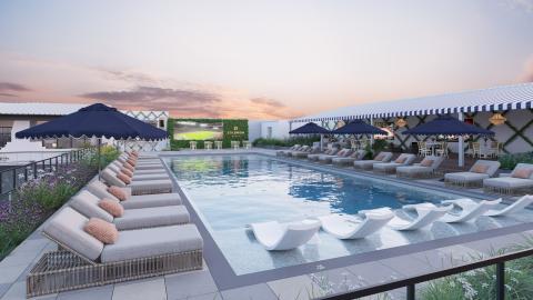 Rendering or photo of a rectangular pool, deck, and lounge chairs in the middle of a mid-rise apartment complex. A one-story clubhouse-type building has a sign that reads "Solomon."